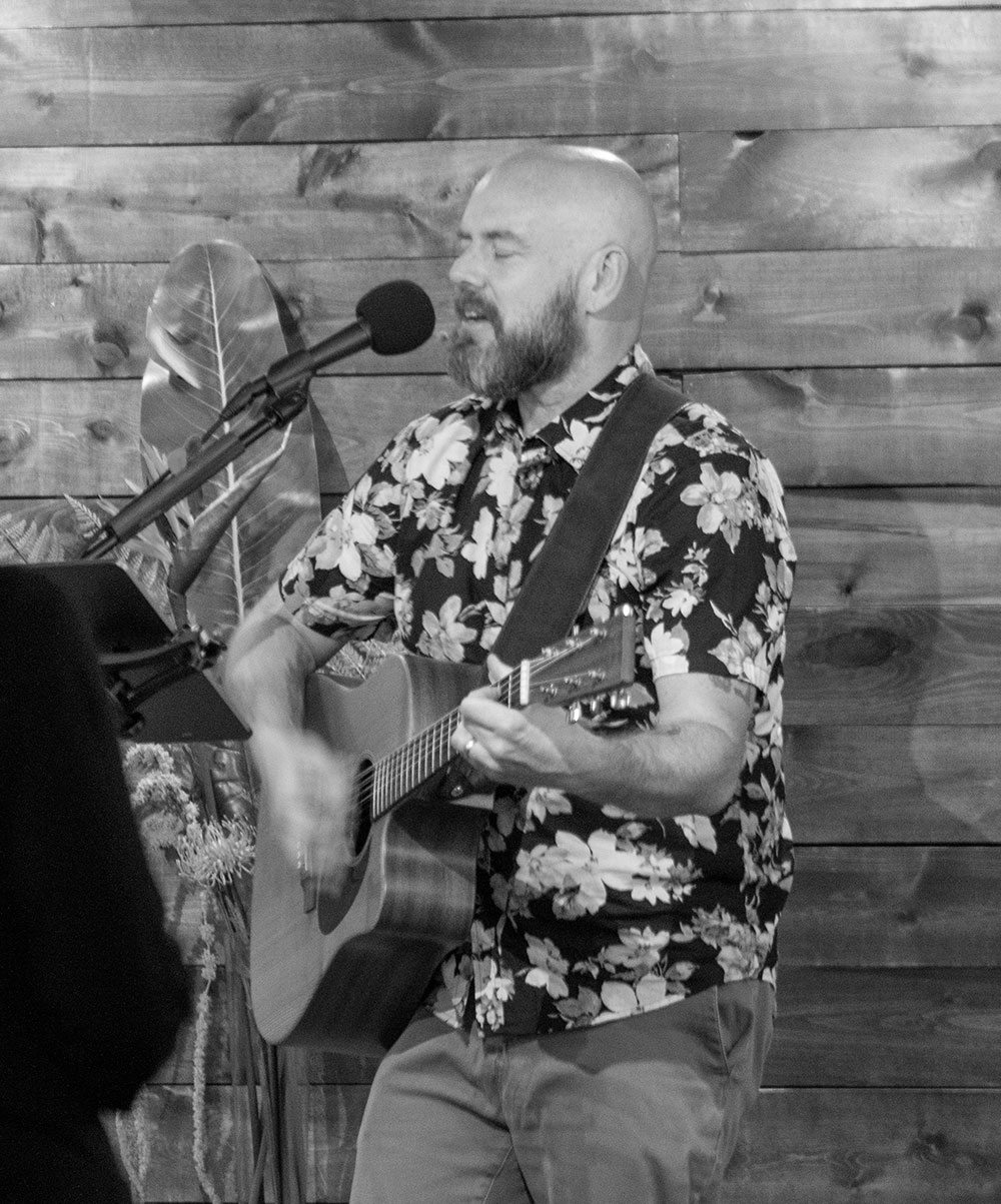 adam-tyler-leading-worship-with-flowered-shirt